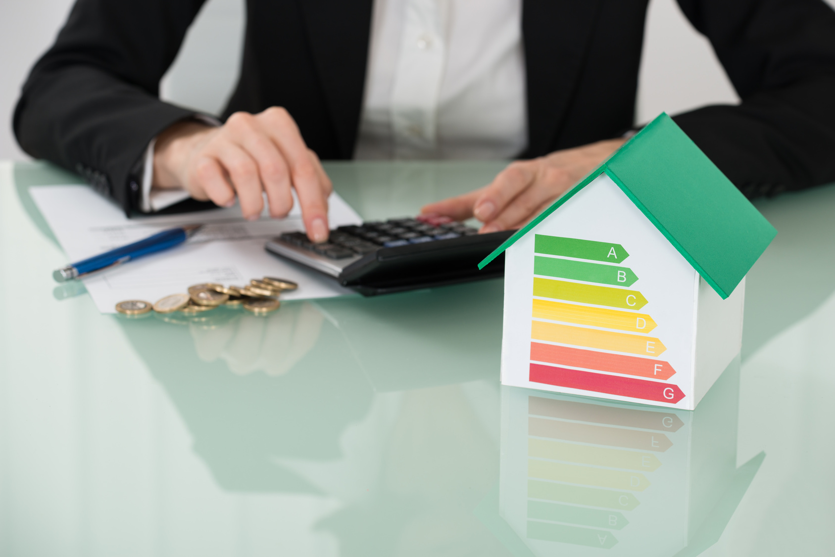 Invoice With Euro Coins And Energy Efficiency Rate On Desk